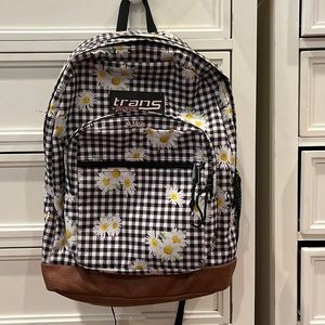 Jansport backpack with black and white plaid and daisies